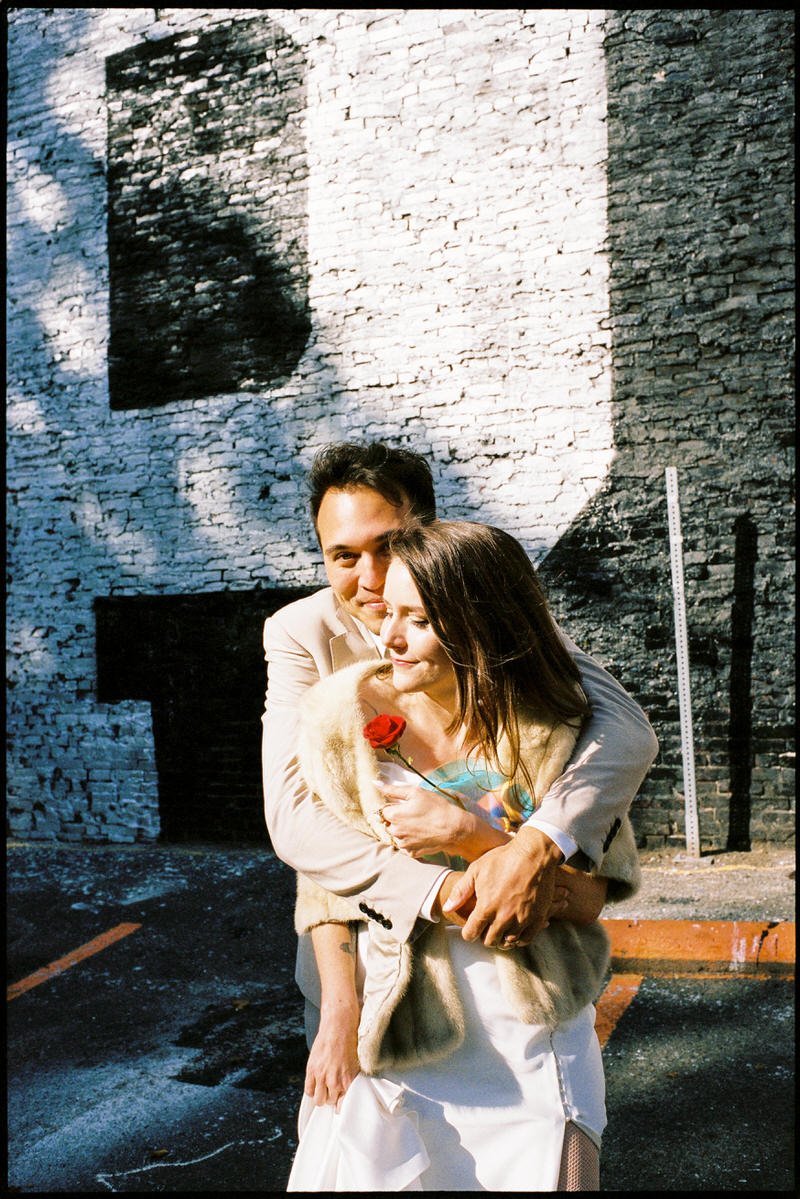 35mm film photo of wedding couple posing in downtown Seattle