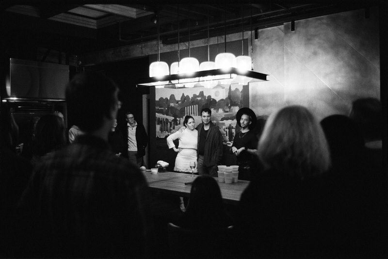 wedding guests looking onwards during a welcome reception in Seattle