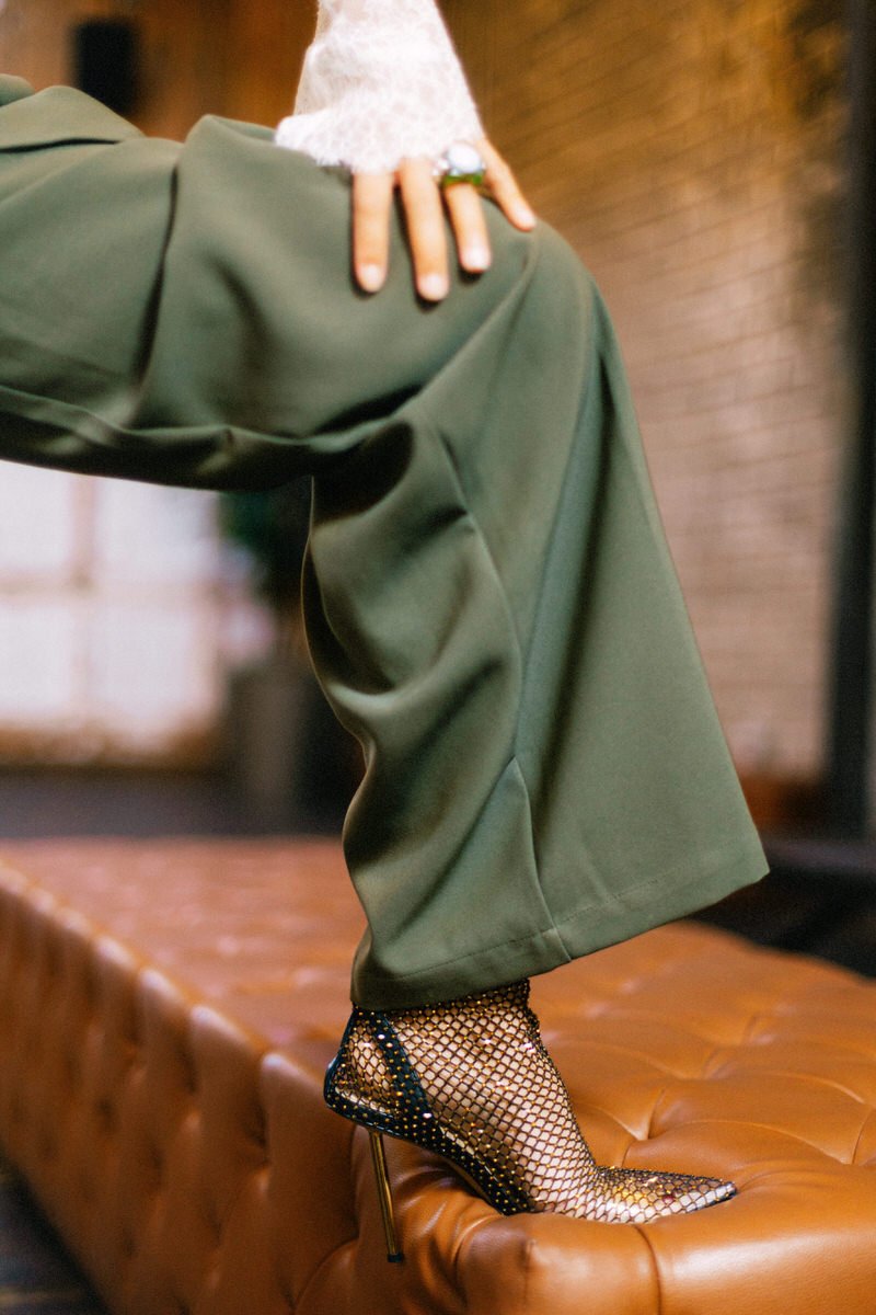 detail of fashionable wedding guest outfit