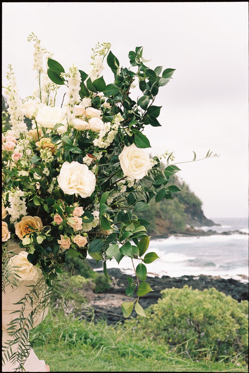 35mm film photo of beautiful floral arrangement with a view of Maui