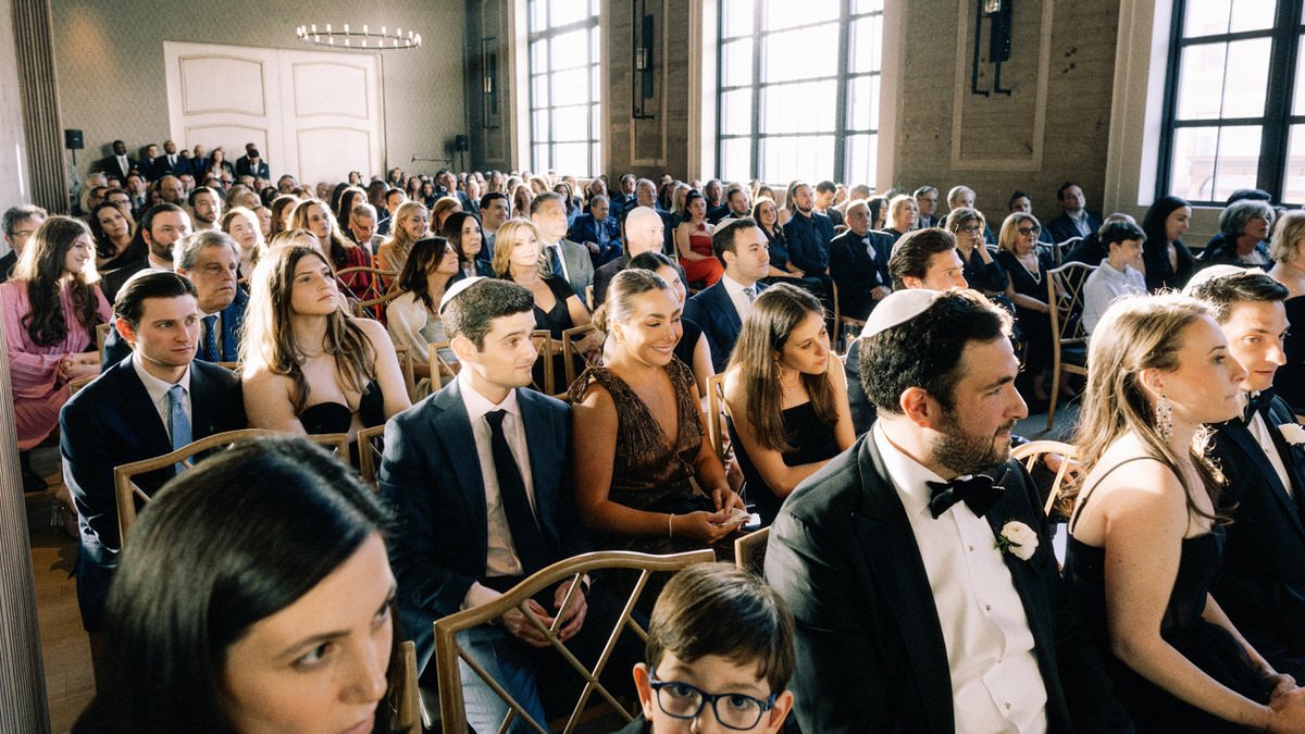 attentive guests during a Jewish ceremony at the Switch House by Cescaphe