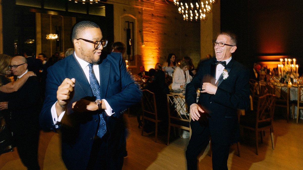 father of the bride dancing with a wedding guest at the Switch House by Cescaphe