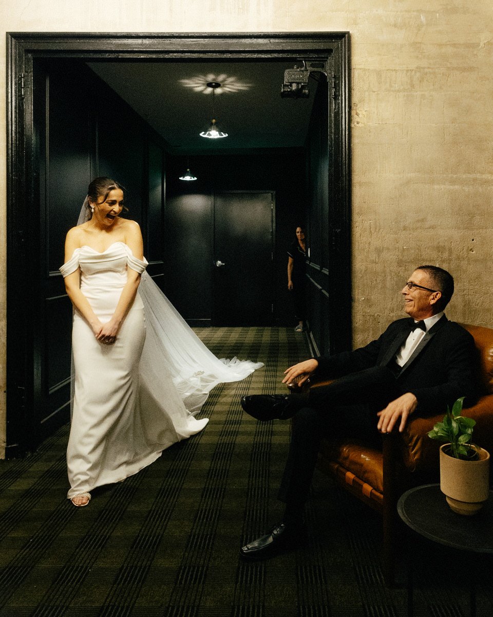 bride and her father sharing an emotional moment during the first look in Philly