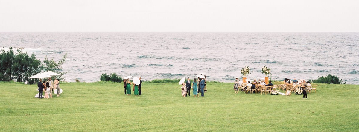 panoramic view of wedding guests waiting for ceremony to begin in Hawaii