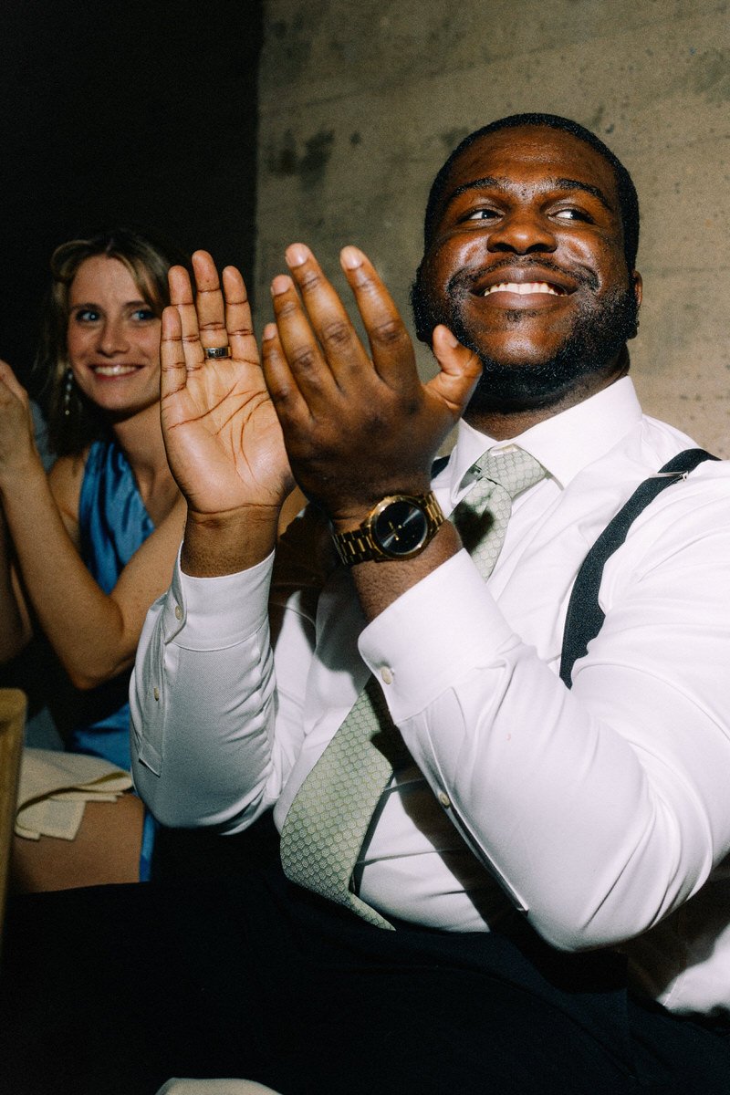 guests clapping during speeches at a wedding reception dinner in Philly