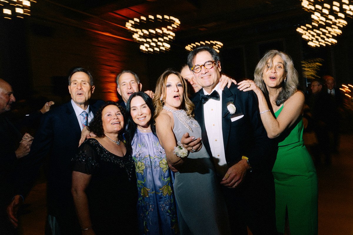 fun group photo of guests enjoying their time at a wedding in Philly
