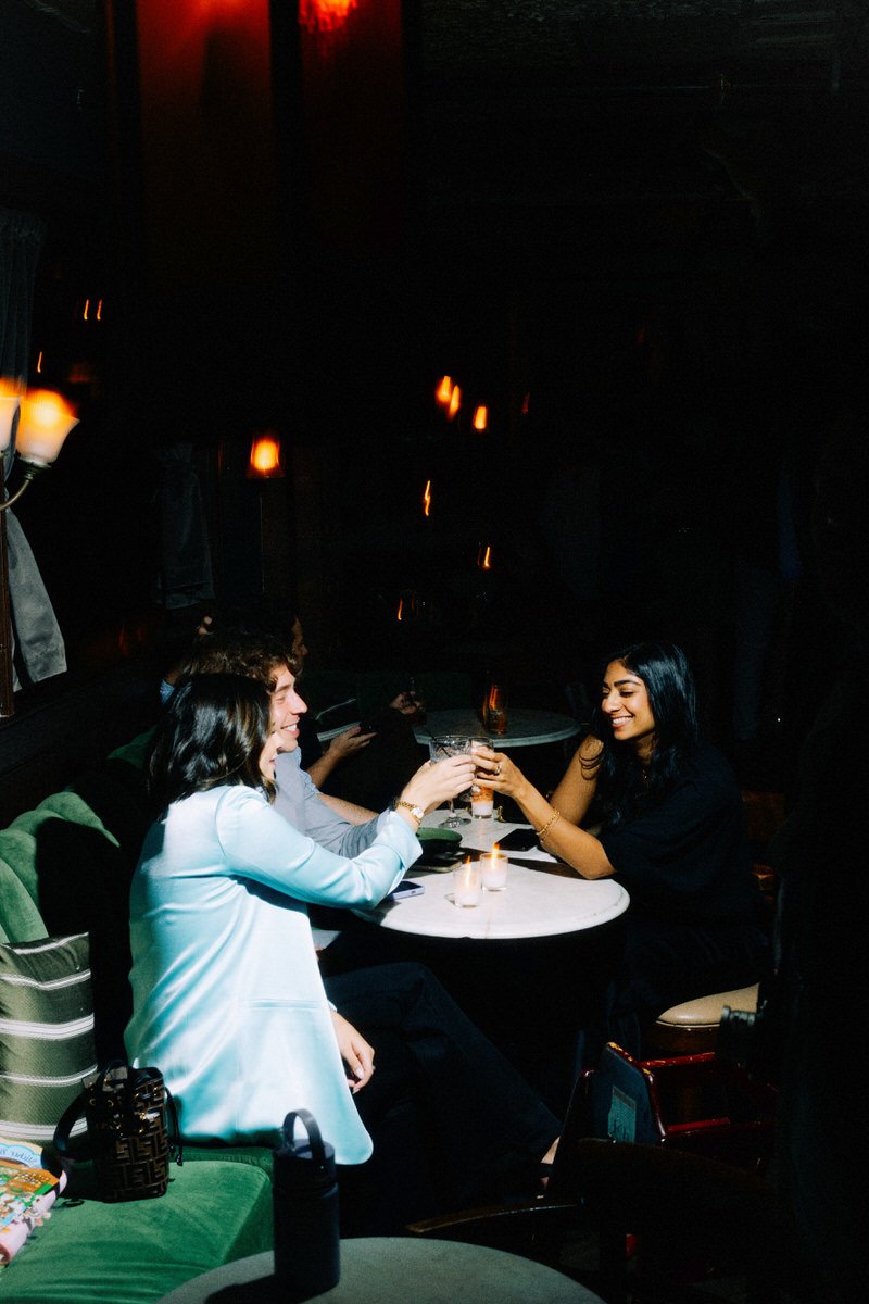 guests clinking glasses together during a wedding welcome event at Harp and Crown in Philadelphia