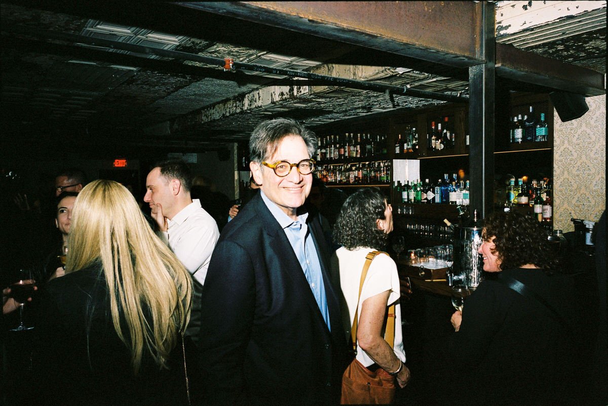 35mm film capture of a guest attending the welcome reception at Harp and Crown Philly