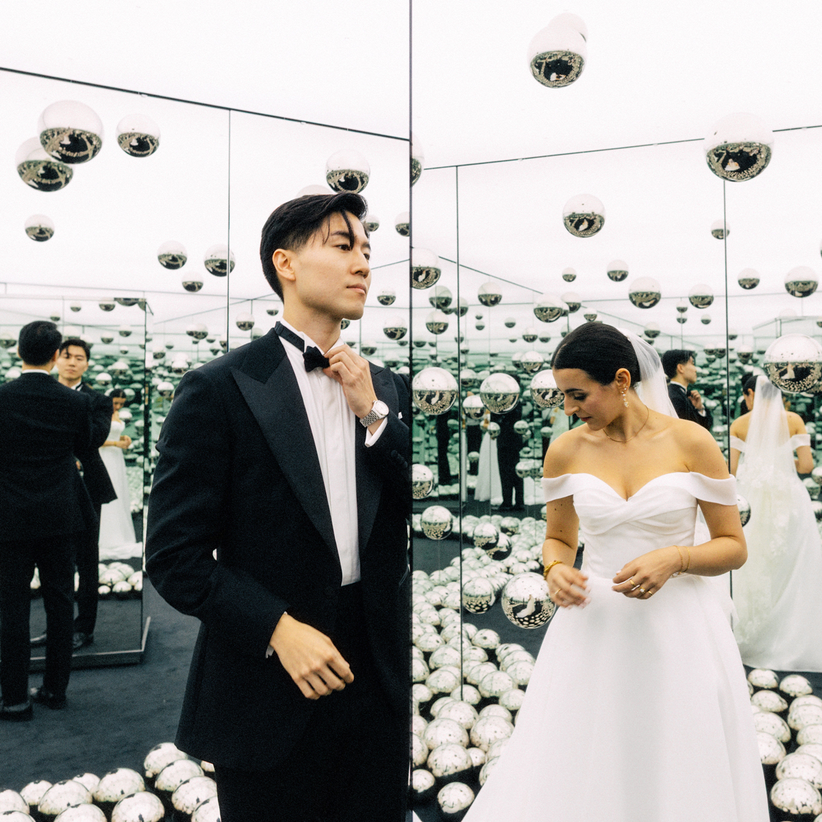 wedding couple photographed inside Yayoi Kusama Mirrored Infinity Room at AGO Toronto