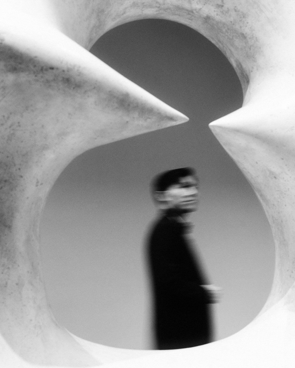 groom framed by Henry Moore sculpture at the AGO Art Gallery of Ontario in Toronto