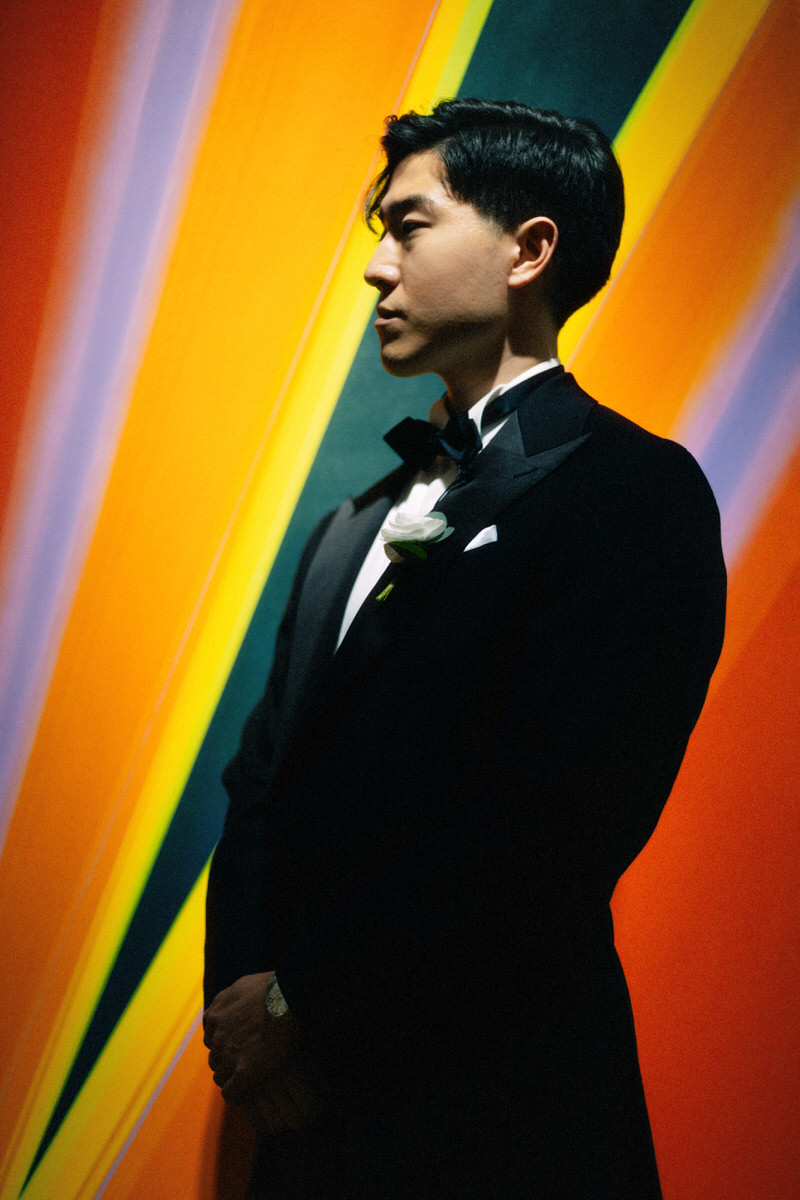 photo of Korean groom in front of a bold modern painting at the AGO Art Gallery of Ontario