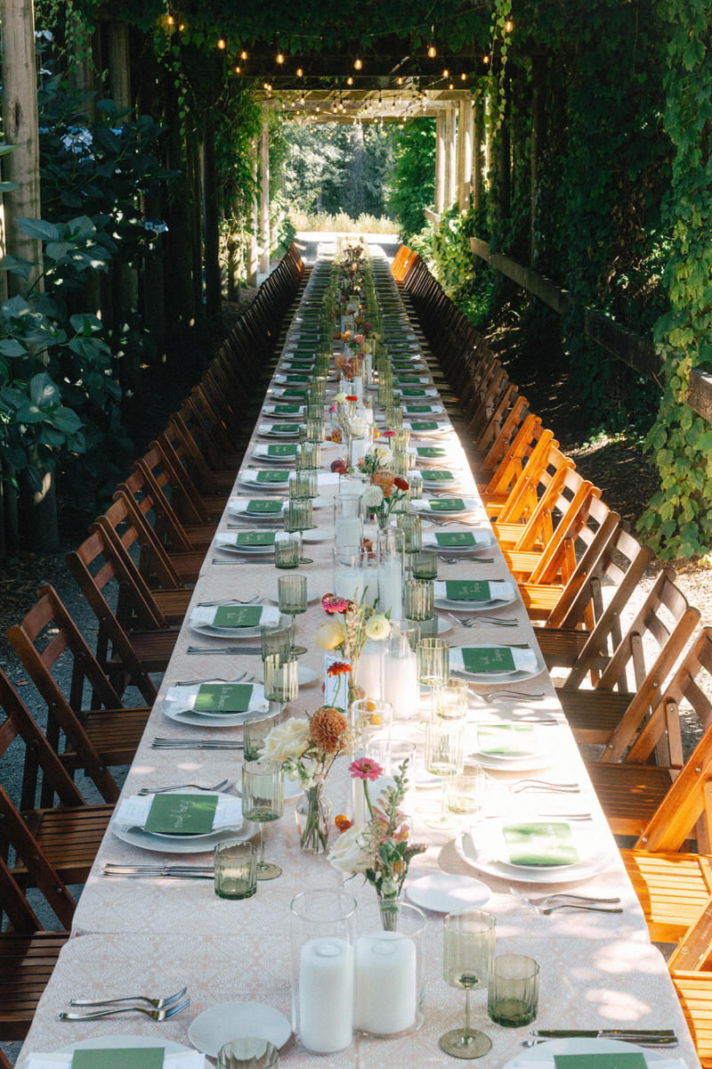 long table dinner reception under the arbour at UBC Botanical Garden