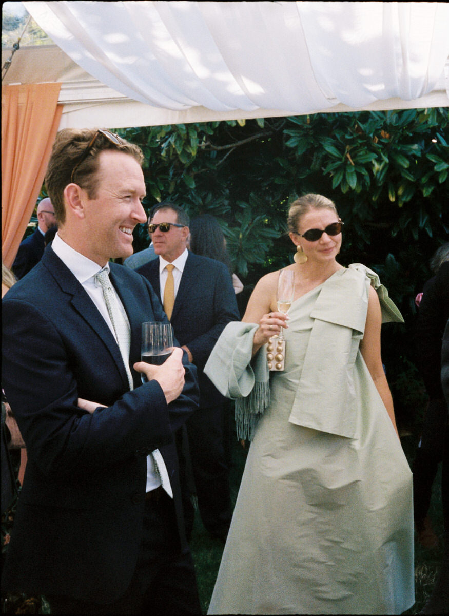 35mm film photo of fashionable guests during a garden party inspired wedding at UBC Botanical Garden