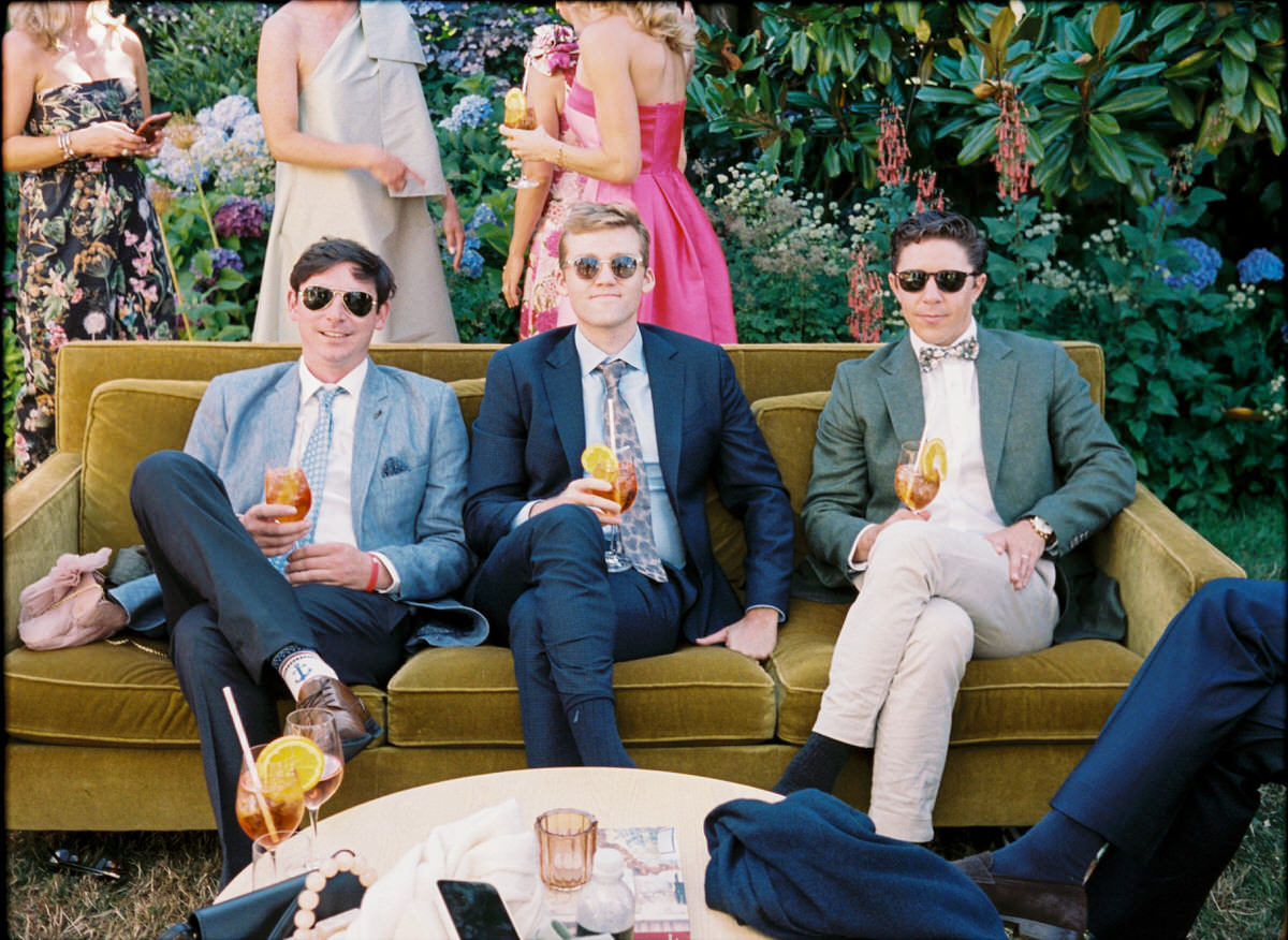 35mm film photo of wedding guests enjoying drinks during cocktail hour at UBC Botanical Garden