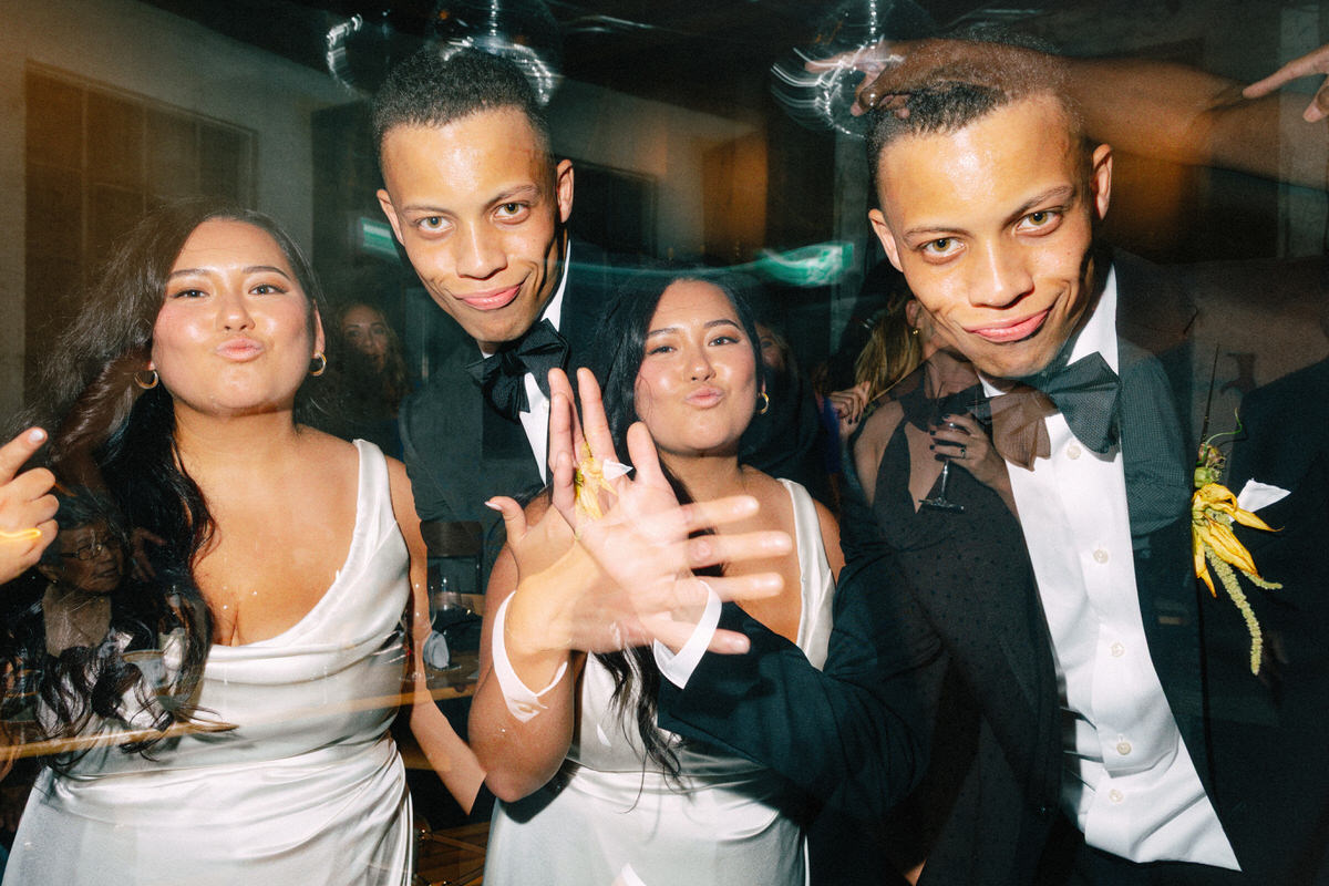 interracial wedding couple playfully posing for the camera. multiple exposures are used to enhance these fun and energetic moments
