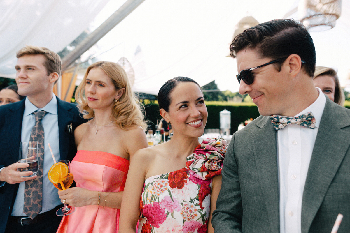 documentary capture of guests listening and reacting to speeches at a UBC Botanical Garden wedding
