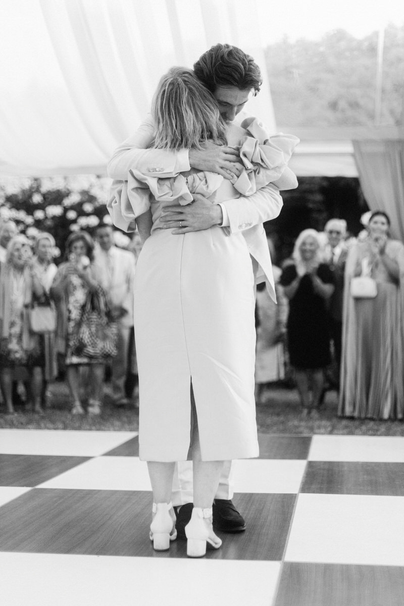 groom hugging his mother after first dances at his UBC Botanical Garden wedding