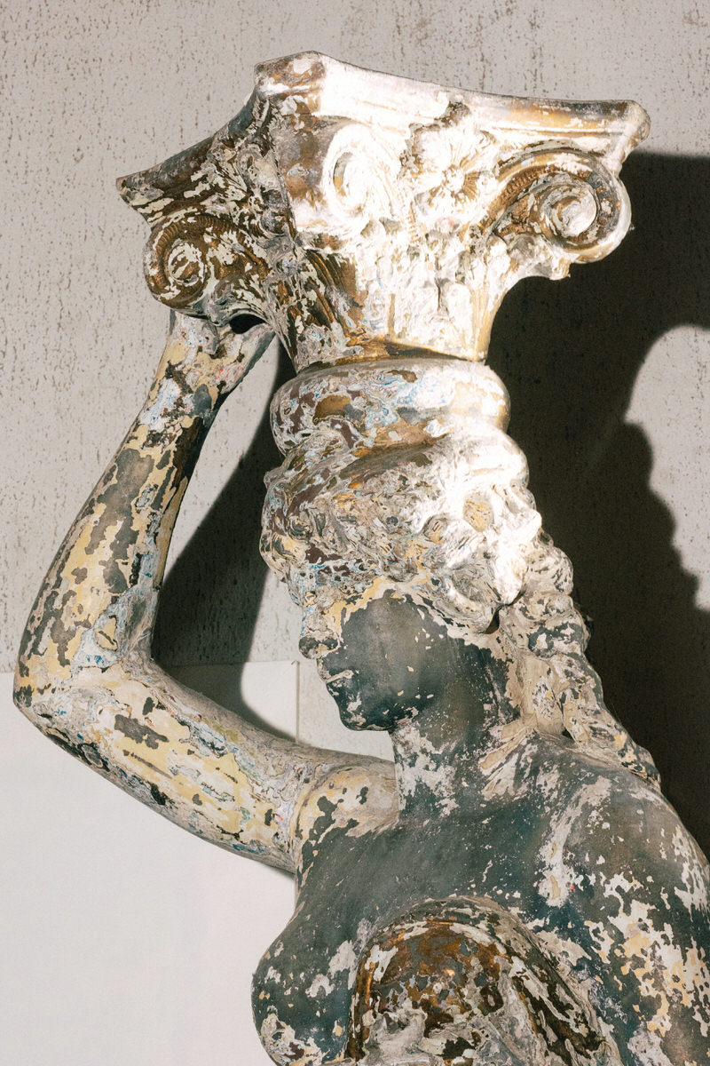 roman bust inspired statue with patina featured at la fabrique st george winery in vancouver