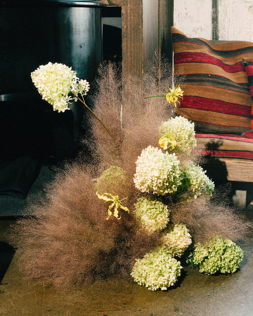 contemporary wedding floral arrangement by kado flower studios using smoke bush and green hydrangea