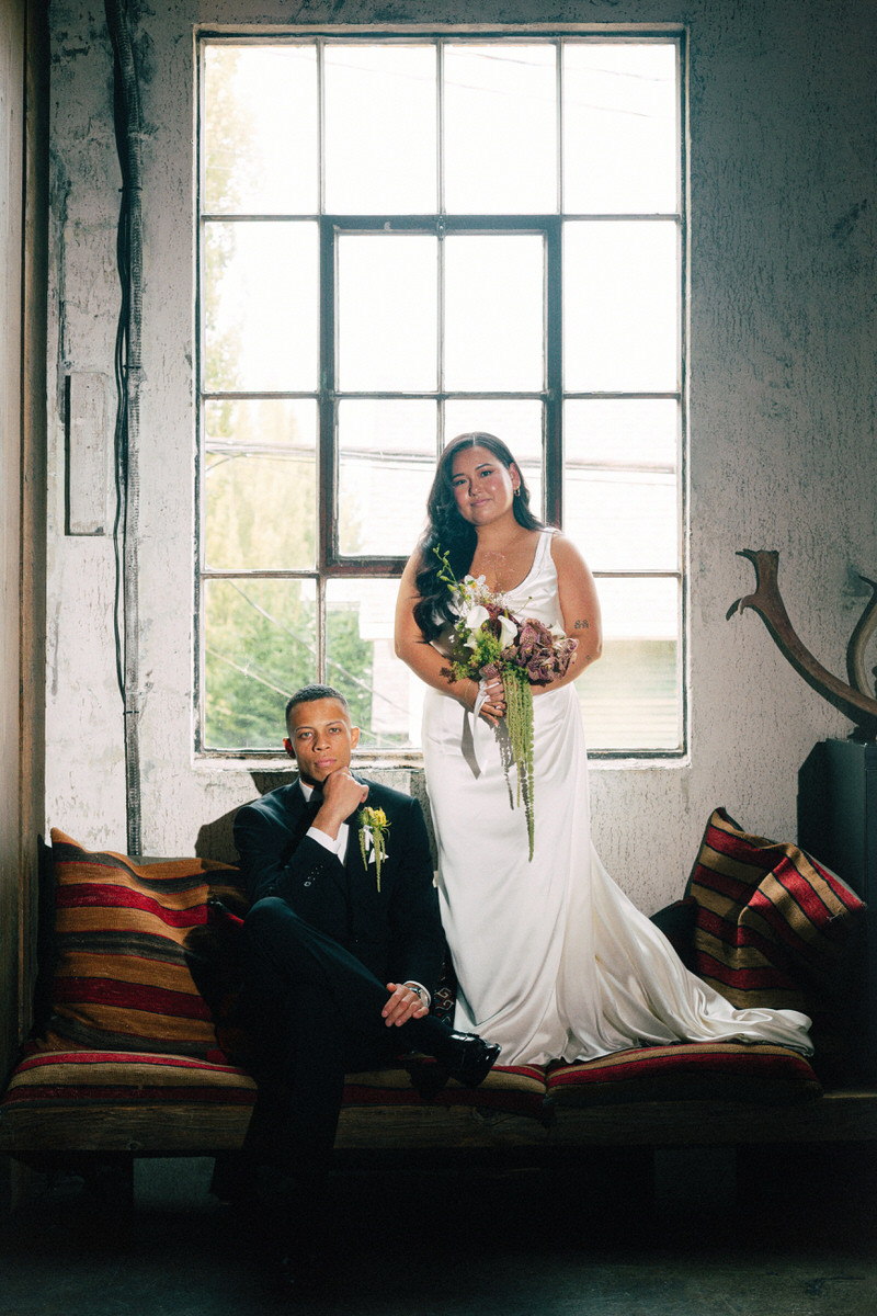 interracial wedding couple posing for an editorial style image at la fabrique st george