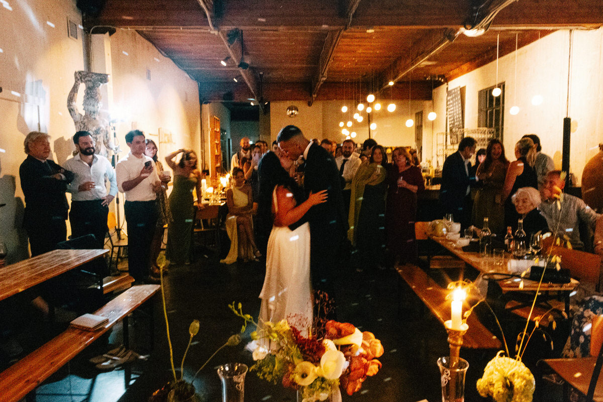newlyweds during their first dance at la fabrique st george in vancouver. moody lighting is used to create an intimate moment