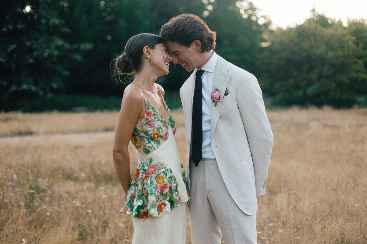 happy bride in Markarian laughing with her husband at UBC Botanical Garden