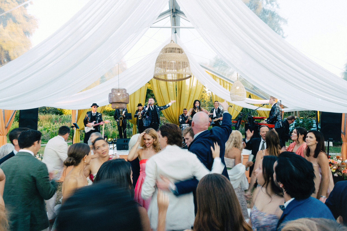 Famous Players Band performing at UBC Botanical Garden during a tented wedding reception