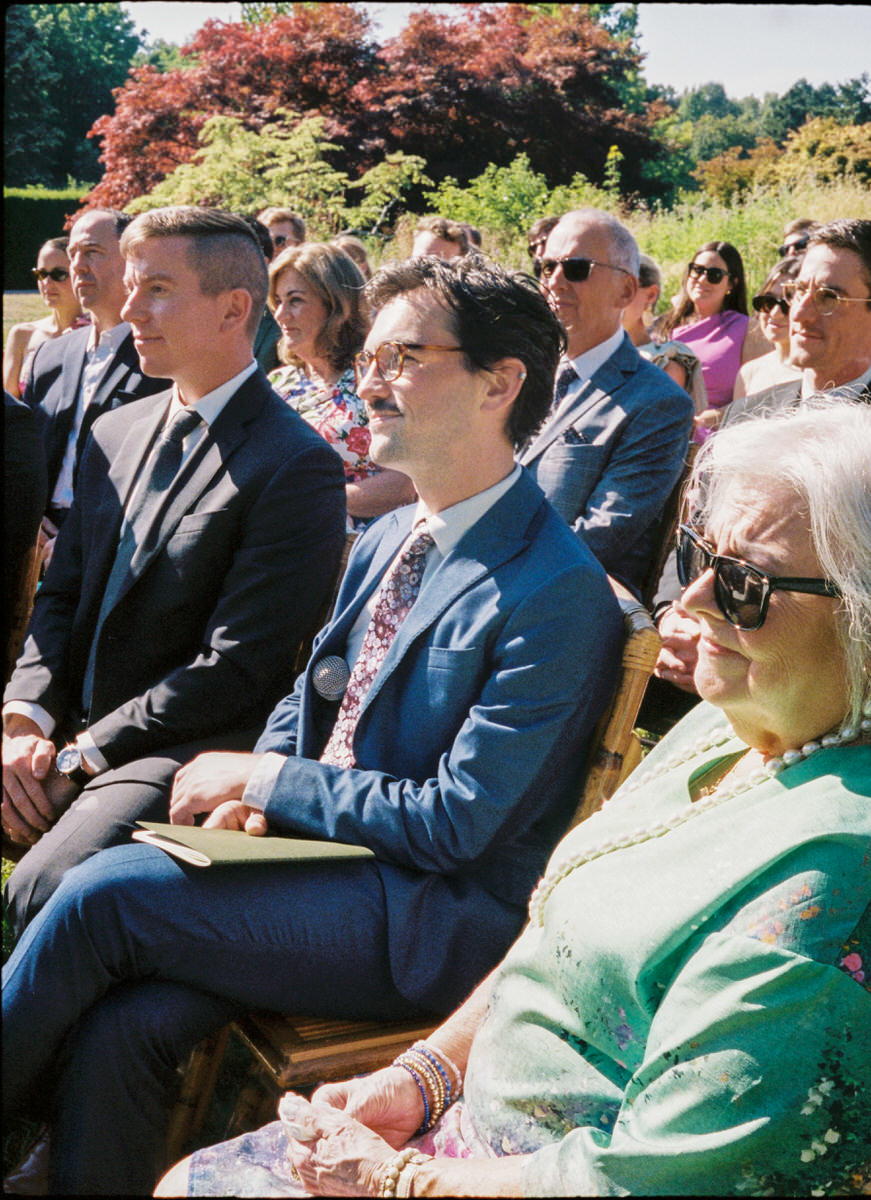 35mm photo of wedding guests waiting for the ceremony to begin at UBC Botanical Garden