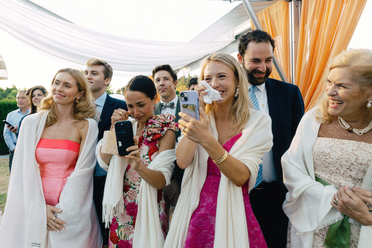 wedding guests emotionally reacting to the first dance between bride and groom at their UBC Botanical Garden wedding