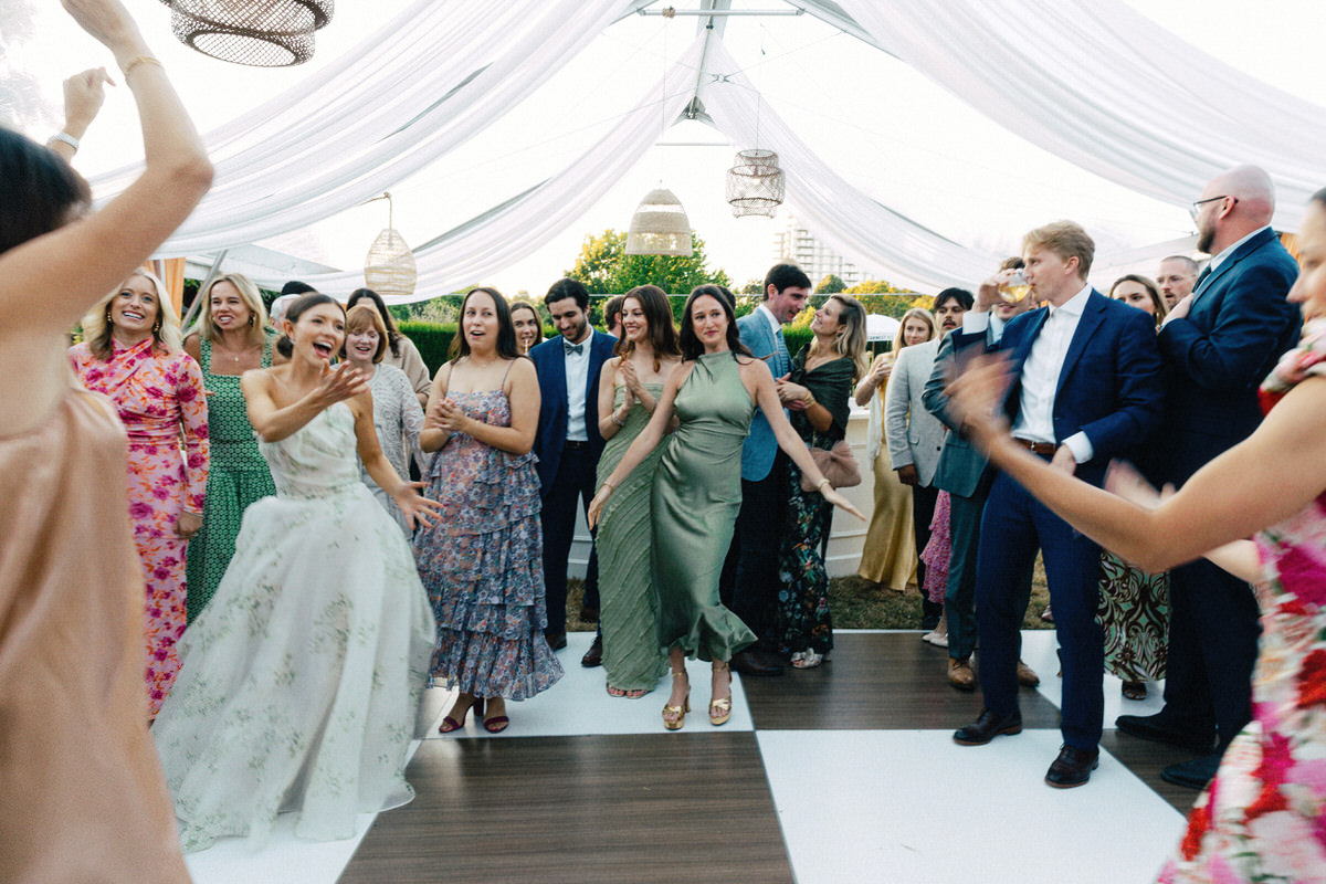 bride in Monique Lhuillier enjoying the dance floor at her UBC Botanical Garden wedding